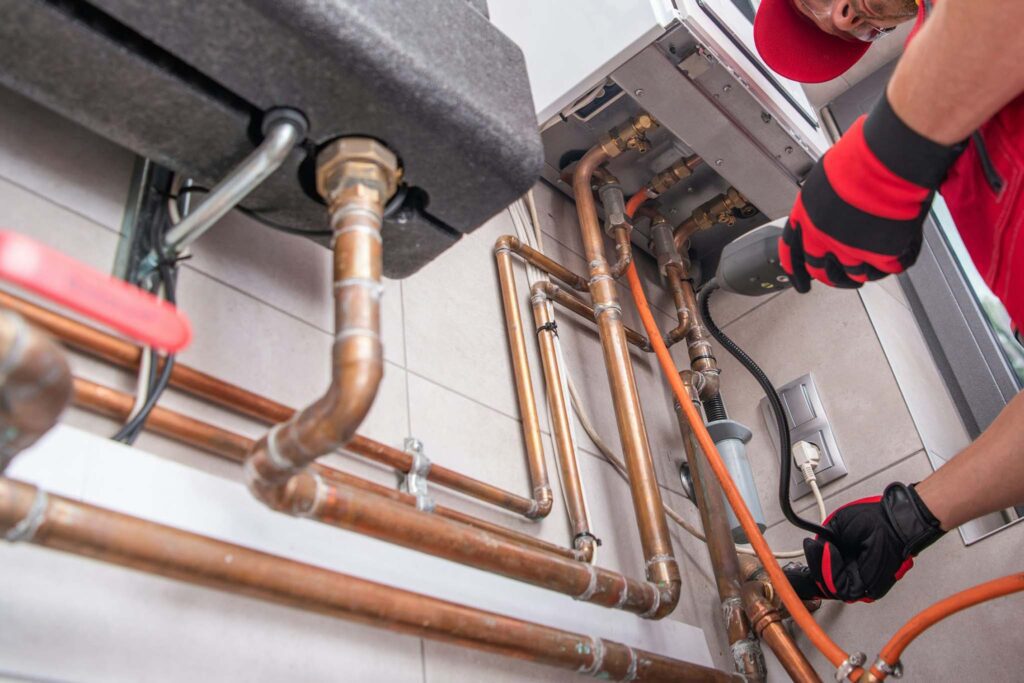 Professional technician checking for gas leaks in Arizona home