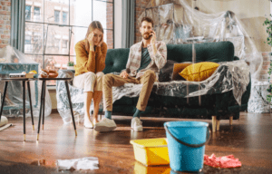 Homeowner documenting water damage for an Arizona plumbing insurance claim.