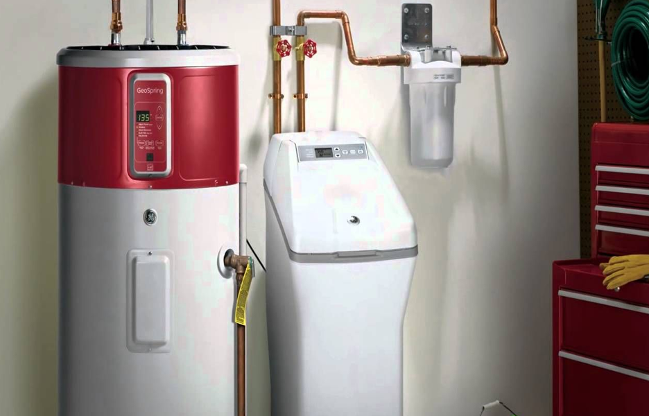 Turnkey high-efficiency water softener installation completed by Aqua Plumbing Services in a Phoenix garage.